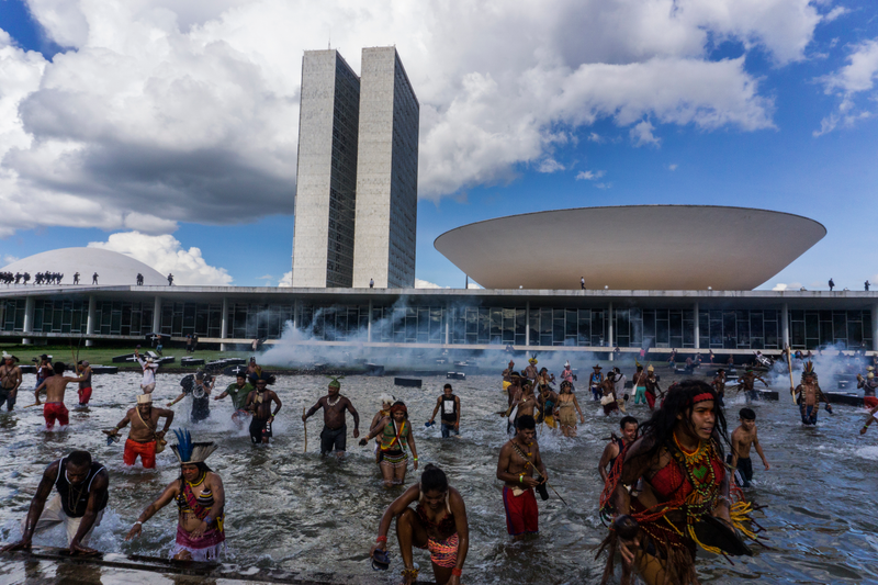At a peaceful demonstration in Brazil this past spring, indigenous people stood up for members of their communities killed in land conflicts. Photo Courtesy Rogério Assis / Mobilização Nacional Indígena